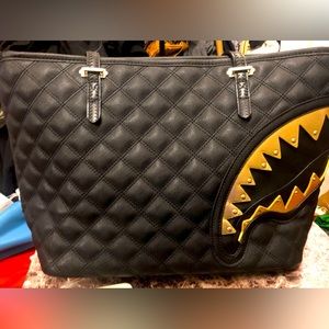 All black with gold shark mouth